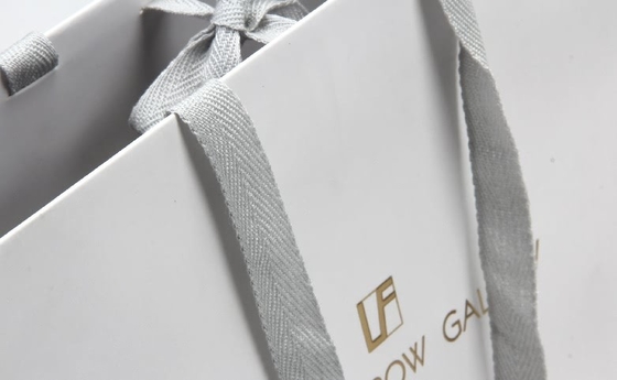 Weiße personalisierte Papiertüten High-End-Brillen Einkaufspapiertüten